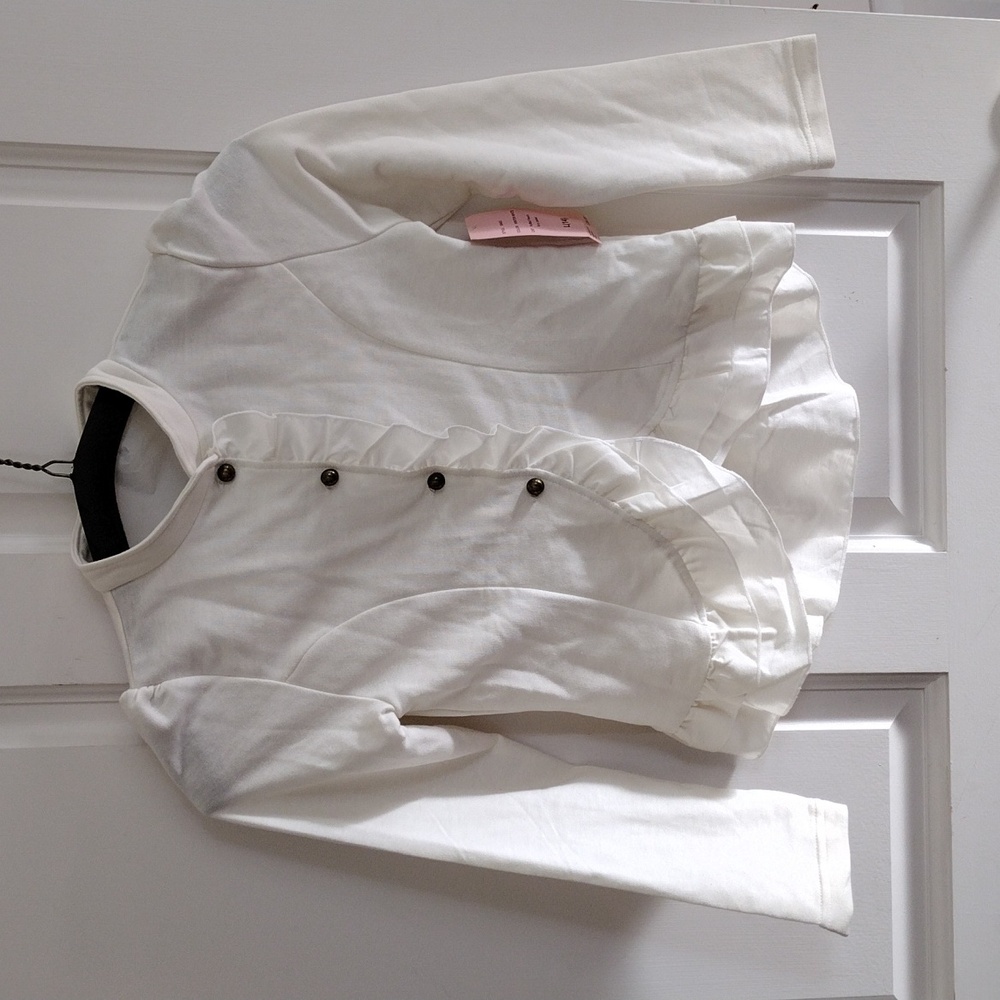 Winter white button down top with ruffles
